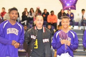 Photo by Jean Kunath Senior Brandon Scott, right, was supported by his family on senior day. Pictured are Raymond Alexander, brother, left, and Robert Scott, father.