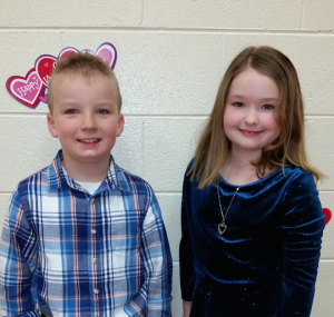 Second-graders Leah Hall and Aidan Parrish smile for the camera.